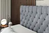 A bedroom scene with a bed and bedside table. Produktbild-Vorschau