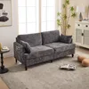 A modern living room with a gray chenille sofa, a side table, a rug, and a cabinet. Produktbild-Vorschau