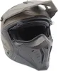 A close-up, front-facing view of a matte sand and black modular motorcycle helmet. Náhled obrázku produktu
