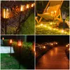 Collage of four images showing solar garden lights in various outdoor settings at night. Náhled obrázku produktu