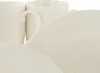A close-up view of white ceramic mugs and plates. Produktbild-Vorschau
