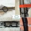 A collage of four images showing black plastic clips used to secure cables and pipes within walls and brickwork. One image includes a measuring tape for scale. Another image shows the product logo and name. Podgląd zdjęcia produktu
