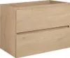 A light oak-colored bathroom cabinet with two drawers, shown from a front-side angle against a white background. Podgląd zdjęcia produktu