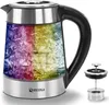 A glass electric kettle with a rainbow-colored interior and a separate tea infuser.