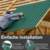 A person installing green metal roofing panels on a wooden structure. Voir les images du produit