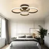 A modern bedroom with a ceiling light fixture. Náhľad obrázku produktu