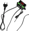 A black and green digital thermostat with a temperature display and a power cord with a European plug, along with a temperature sensor probe. Voir les images du produit