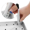 A close-up view of a person's hand operating a mechanism on a white metal step stool. Anteprima dell’immagine prodotto