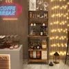 A coffee break station with a shelf unit displaying coffee-related items and baked goods. Produktbild-Vorschau