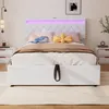 A white upholstered bed with LED lighting and stuffed animals on the pillows. Náhled obrázku produktu