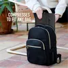 A person is placing a black laptop sleeve into a black backpack. Anteprima dell’immagine prodotto