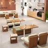 A modern cafe interior with various seating arrangements and tables. Produktbild-Vorschau