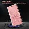 A pink phone case with a lotus and dragonfly design is shown at an angle, with debris falling around it to illustrate its shockproof feature. Produktbild-Vorschau