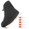 A black boot cover with a size chart next to it. Produktbild-Vorschau