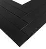 A close-up, angled view of black wooden planks arranged in a herringbone pattern against a white background. Anteprima dell’immagine prodotto