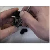 Hands are shown cleaning a printer part with a tool, resting on a paper towel. Produktbild-Vorschau