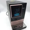 A black and rose gold coffee machine with a touchscreen display showing coffee options. Produktbild-Vorschau