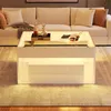A modern living room with a white coffee table in front of a sofa. Voir les images du produit