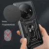 A hand holding a black smartphone case with a ring holder and a camera cover. Produktbild-Vorschau