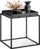 A black metal side table with decorative items on top. Produktbild-Vorschau