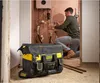 A plumber is working on pipes in a room with a tool bag in the foreground. Anteprima dell’immagine prodotto