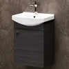 A modern bathroom vanity with a sink and faucet against a tiled wall. Produktbild-Vorschau