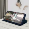 A dark blue phone case with a phone displaying a video is propped up on a wooden surface. Náhľad obrázku produktu