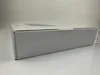A side view of a closed white cardboard box, likely packaging for an electronic product. Produktbild-Vorschau