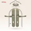 A pair of bronze-colored door handles are displayed against a light beige background with a stylized house outline and text. Produktbild-Vorschau