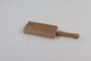A wooden gnocchi board with a handle, placed on a white background. Produktbild-Vorschau