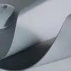 A close-up view of a gray mousepad with a white computer mouse on the left side. Anteprima dell’immagine prodotto