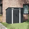 A dark gray metal garden shed is placed on a grassy lawn next to a brick building. Náhled obrázku produktu