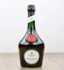 A bottle of Benedictine DOM liqueur is displayed on a wooden surface against a white background. Produktbild-Vorschau