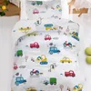 A close-up view of a child's duvet cover with a pattern of various vehicles. Produktbild-Vorschau