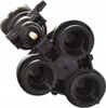 A black plastic component with multiple openings and a small white protrusion. Podgląd zdjęcia produktu