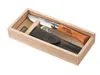 A knife and its leather sheath are presented in a wooden box. Anteprima dell’immagine prodotto