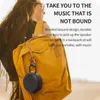 A person wearing a backpack with a speaker attached. Produktbild-Vorschau