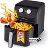 A black air fryer with a basket full of french fries and fried chicken pieces spilling out. Produktbild-Vorschau