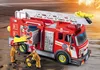 Two firefighters are interacting with a red fire truck. Produktbild-Vorschau