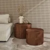 Two wooden side tables with a vase of dried flowers on one, next to a sofa. Produktbild-Vorschau