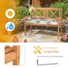 A wooden garden bench with cushions is shown in an outdoor setting with plants and stone paving. Informational icons and text are overlaid on the left and bottom right. Voir les images du produit