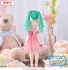 A figurine of Hatsune Miku is displayed in a decorative setting with a teddy bear and gifts. Produktbild-Vorschau