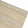 A close-up view of a light-colored wood grain surface, likely a tabletop or furniture. Náhled obrázku produktu