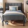 A bedroom setting with a bed, nightstand, and sports equipment. Produktbild-Vorschau