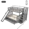 A diagram of a gray bunk bed with a slide and stairs, showing dimensions and features. Produktbild-Vorschau
