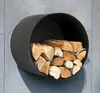 A black, round, wall-mounted firewood rack filled with logs, attached to a gray tiled wall. Produktbild-Vorschau
