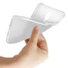 A hand holding a transparent phone case. Podgląd zdjęcia produktu