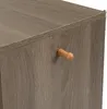 A close-up view of a wooden cabinet with a wooden handle. Produktbild-Vorschau