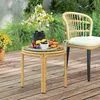An outdoor patio scene with a small round table set for a snack. Podgląd zdjęcia produktu