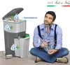 A man is sitting on the floor with plastic bottles, next to a multi-compartment trash can. Náhľad obrázku produktu